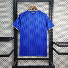 Real side of Italy home jersey wc 2026 anging on a rack with a branded label.