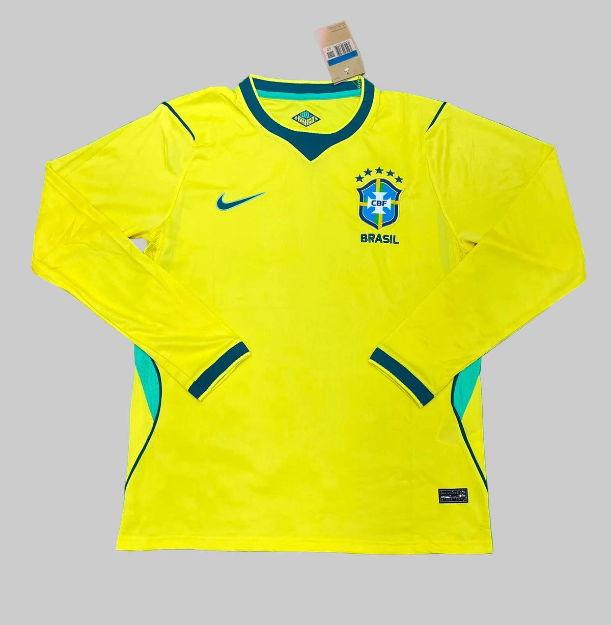 Yellow soccer jersey with Nike logo on a green background